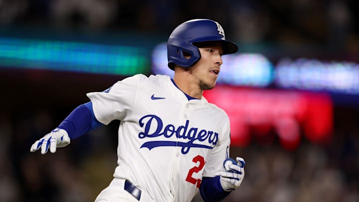 Apr 28, 2025; Los Angeles, California, USA; Los Angeles Dodgers second baseman Tommy Edman (25) runs after hitting a walk off, two-RBI single in the 10th inning against the Miami Marlins at Dodger Stadium. Mandatory Credit: Jason Parkhurst-Imagn Images Apr 28, 2025; Los Angeles, California, USA; Los Angeles Dodgers second baseman Tommy Edman (25) runs after hitting a walk off, two-RBI single in the 10th inning against the Miami Marlins at Dodger Stadium. Mandatory Credit: Jason Parkhurst-Imagn Images