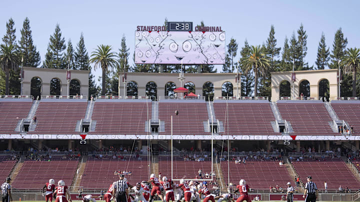 Oct 5, 2024; Stanford, California, USA;  Fans remain in the concourse to escape the heat as they watch the Virginia Tech Hokies kick a field goal against the Stanford Cardinal during the fourth quarter at Stanford Stadium. Mandatory Credit: Stan Szeto-Imagn Images