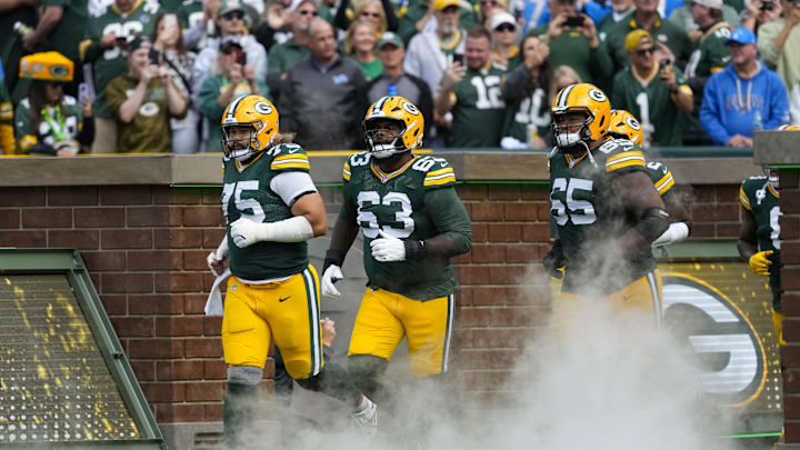 Sep 7, 2025; Green Bay, Wisconsin, USA;  Green Bay Packers guard Sean Rhyan (75), offensive tackle Rasheed Walker (63) and guard Aaron Banks (65) prior to the game against the Detroit Lions at Lambeau Field. Mandatory Credit: Jeff Hanisch-Imagn Images