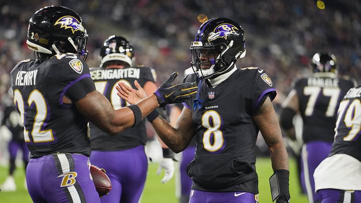 Dec 21, 2025; Baltimore, Maryland, USA; Baltimore Ravens quarterback Lamar Jackson (8) congratulates running back Derrick Henry (22) on a touchdown run against the New England Patriots during the first quarter at M&T Bank Stadium. Mandatory Credit: Mitch Stringer-Imagn Images Dec 21, 2025; Baltimore, Maryland, USA; Baltimore Ravens quarterback Lamar Jackson (8) congratulates running back Derrick Henry (22) on a touchdown run against the New England Patriots during the first quarter at M&T Bank Stadium. Mandatory Credit: Mitch Stringer-Imagn Images