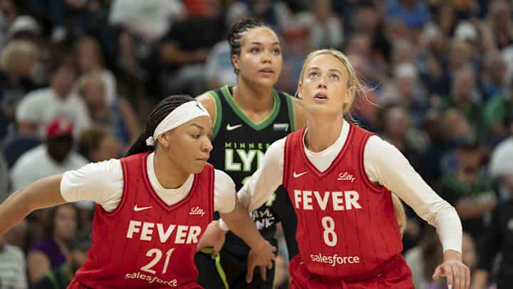Jul 1, 2025; Minneapolis, Minnesota, USA; Indiana Fever guard Sophie Cunningham (8) and Indiana Fever forward Makayla Timpson (21) box out Minnesota Lynx forward Napheesa Collier (24) for a rebound in the second half during the Commissioner's Cup final at Target Center. Mandatory Credit: Jesse Johnson-Imagn Images