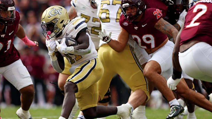 Oct 26, 2024; Blacksburg, Virginia, USA; Georgia Tech Yellow Jackets running back Jamal Haynes (11) runs the ball during the first quarter against the Virginia Tech Hokies at Lane Stadium. Mandatory Credit: Peter Casey-Imagn Images