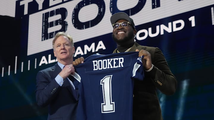 Apr 24, 2025; Green Bay, WI, USA; NFL commissioner Roger Goodell with Alabama Crimson Tide offensive lineman Tyler Booker after he is selected by the Dallas Cowboys as the number twelve pick in the first round of the 2025 NFL Draft at Lambeau Field. Mandatory Credit: Kirby Lee-Imagn Images