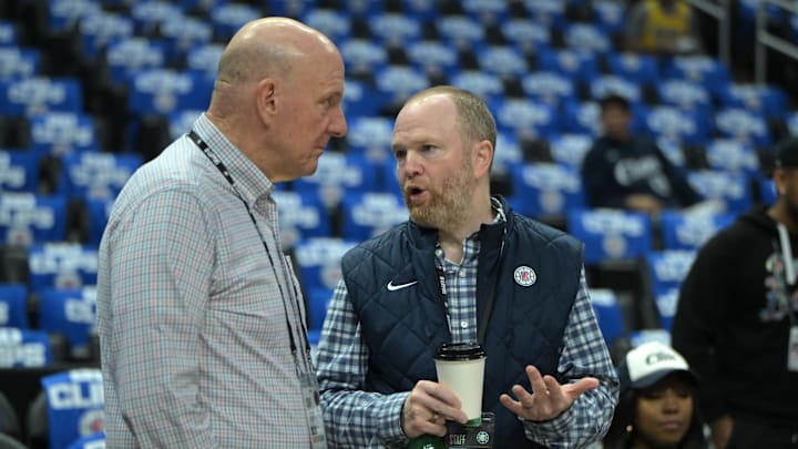 Apr 21, 2024; Los Angeles, California, USA; Los Angeles Clippers owner Steve Ballmer, left, talks with Lawrence Frank, President of Basketball Operations, prior to game one of the first round for the 2024 NBA playoffs against the Dallas Mavericks at Crypto.com Arena. Mandatory Credit: Jayne Kamin-Oncea-Imagn Images