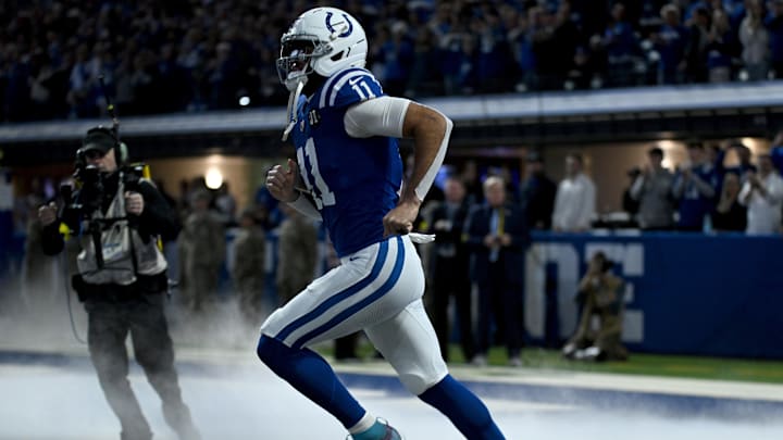 Nov 30, 2025; Indianapolis, Indiana, USA; Indianapolis Colts wide receiver Michael Pittman Jr. (11) is introduced before a game against the Houston Texans at Lucas Oil Stadium. Mandatory Credit: Robert Goddin-Imagn Images