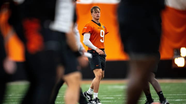 Cincinnati Bengals quarterback Joe Burrow (9) stretches with the rest of the team at Bengals spring practice at the IEL Indoor Facility in Cincinnati on Tuesday, June 11, 2024. Cincinnati Bengals quarterback Joe Burrow (9) stretches with the rest of the team at Bengals spring practice at the IEL Indoor Facility in Cincinnati on Tuesday, June 11, 2024.