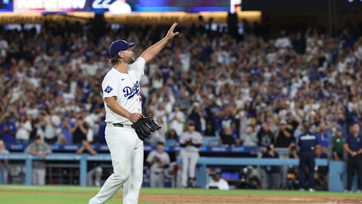 Sep 19, 2025; Los Angeles, California, USA; Los Angeles Dodgers pitcher Clayton Kershaw (22) salutes the crowd after being relieved during the fifth inning against the San Francisco Giants at Dodger Stadium. Mandatory Credit: Kiyoshi Mio-Imagn Images