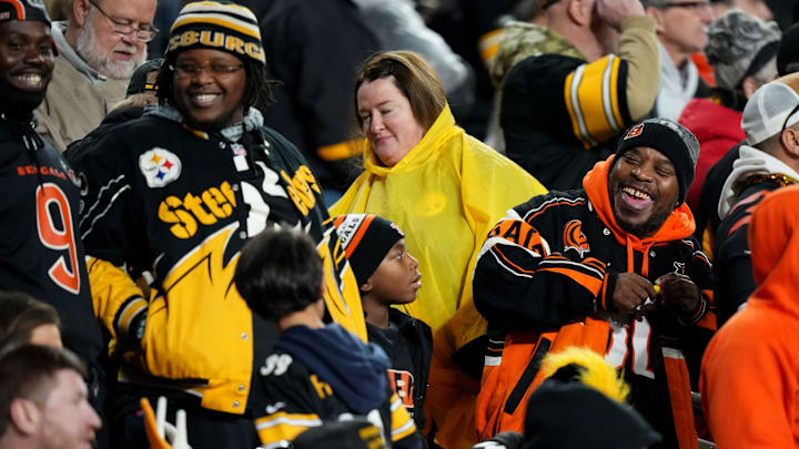 Cincinnati Bengals and Pittsburgh Steelers fans enjoy a laugh between the third and fourth quarters during a Week 16 NFL football game between the Cincinnati Bengals and the Pittsburgh Steelersl, Saturday, Dec. 23, 2023, at Acrisure Stadium in Pittsburgh, Pa.
