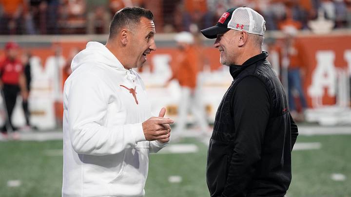 Texas Longhorns head coach Steve Sarkisian talks with Texas Tech Red Raiders head coach Joey McGuire before the game at Darrell K Royal-Texas Memorial Stadium. Texas Longhorns head coach Steve Sarkisian talks with Texas Tech Red Raiders head coach Joey McGuire before the game at Darrell K Royal-Texas Memorial Stadium.