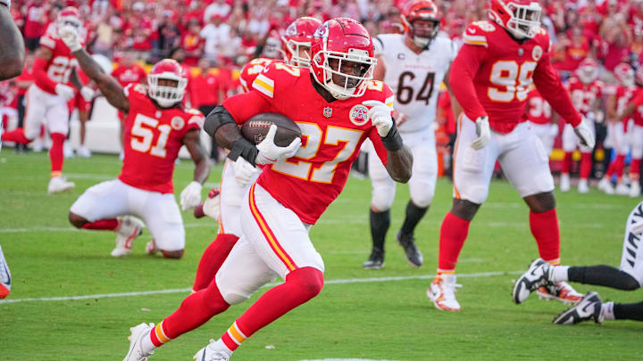 Sep 15, 2024; Kansas City, Missouri, USA; Kansas City Chiefs safety Chamarri Conner (27) recovers a fumble and runs in for a touchdown against the Cincinnati Bengals during the second half at GEHA Field at Arrowhead Stadium. Mandatory Credit: Denny Medley-Imagn Images