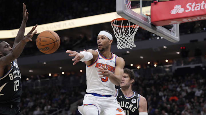 New York Knicks guard Josh Hart drives to the basket against Milwaukee Bucks center Brook Lopez. Mandatory Credit: Michael McLoone-Imagn Images