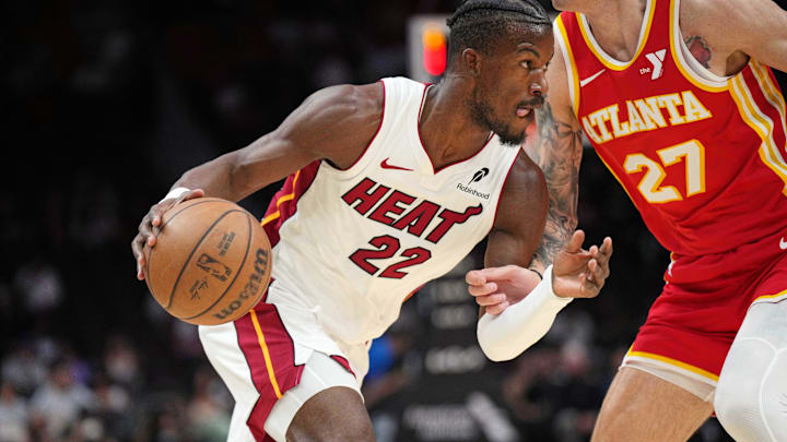 Oct 16, 2024; Miami, Florida, USA;  Miami Heat forward Jimmy Butler (22) drives past Atlanta Hawks guard Vit Krejci (27) in the first half at Kaseya Center. Mandatory Credit: Jim Rassol-Imagn Images
