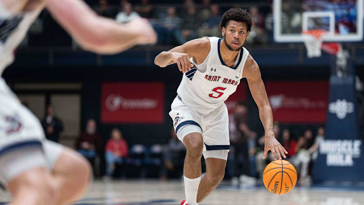 Nov 27, 2023; Moraga, California, USA;  St. Mary's Gaels forward Joshua Jefferson (5) controls the ball during the second half against the Utah Utes at University Credit Union Pavilion. Mandatory Credit: Stan Szeto-USA TODAY Sports