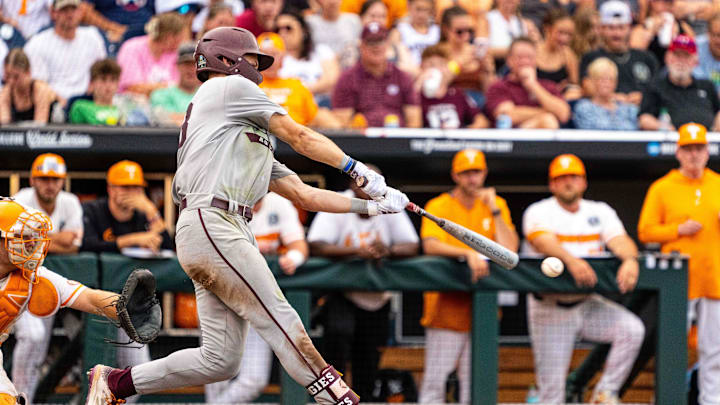 Jun 22, 2024; Omaha, NE, USA; Texas A&M Aggies left fielder Caden Sorrell (13) hits a RBI single against the Tennessee Volunteers during the third inning at Charles Schwab Field Omaha. Mandatory Credit: Dylan Widger-Imagn Images