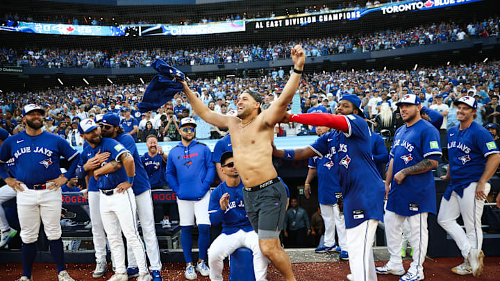 The Toronto Blue Jays celebrate their AL East win. Who deserved to be called the team MVP? The Toronto Blue Jays celebrate their AL East win. Who deserved to be called the team MVP?