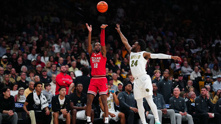 Jan 10, 2026; Boulder, Colorado, USA; Texas Tech Red Raiders forward Donovan Atwell (12) shoots the ball over Colorado Buffaloes guard Barrington Hargress (24) during the first half at the CU Events Center. Mandatory Credit: Ron Chenoy-Imagn Images