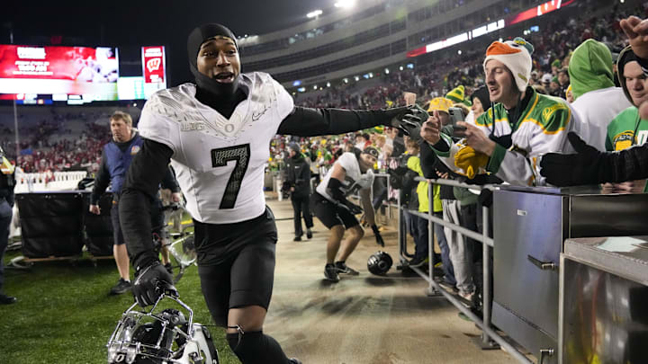 Nov 16, 2024; Madison, Wisconsin, USA;  Oregon Ducks wide receiver Evan Stewart (7) greets fans following the game against the Wisconsin Badgers at Camp Randall Stadium. Mandatory Credit: Jeff Hanisch-Imagn Images