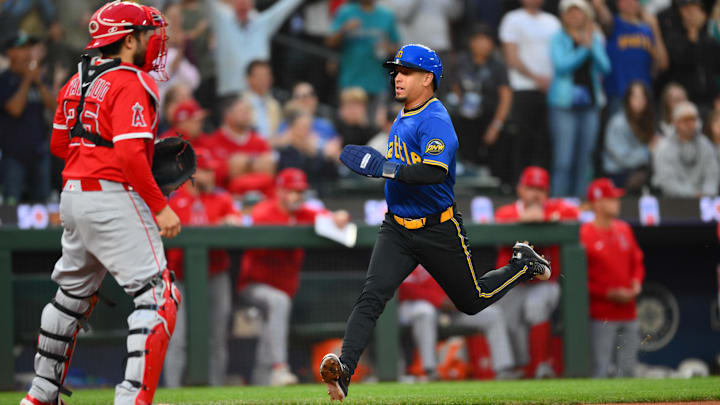 Sep 11, 2025; Seattle, Washington, USA; Seattle Mariners second baseman Leo Rivas (76) scores a run against the Los Angeles Angels during the second inning at T-Mobile Park. Mandatory Credit: Steven Bisig-Imagn Images Sep 11, 2025; Seattle, Washington, USA; Seattle Mariners second baseman Leo Rivas (76) scores a run against the Los Angeles Angels during the second inning at T-Mobile Park. Mandatory Credit: Steven Bisig-Imagn Images