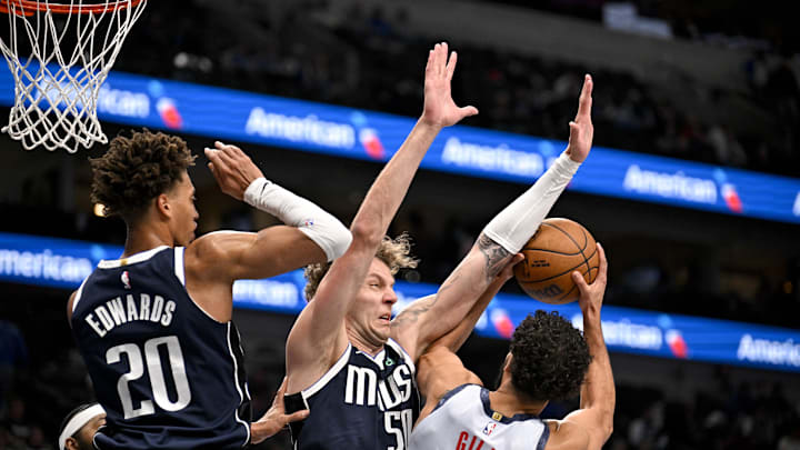 Jan 27, 2025; Dallas, Texas, USA; Washington Wizards forward Anthony Gill (16) looks to shoot over Dallas Mavericks center Kylor Kelley (50) during the second half at the American Airlines Center. Mandatory Credit: Jerome Miron-Imagn Images