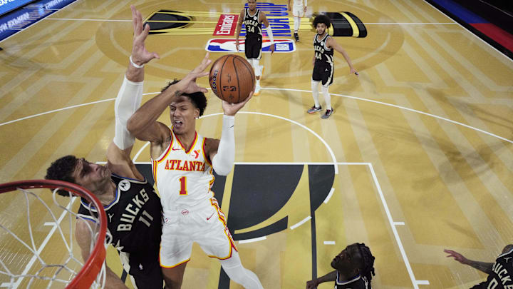 Dec 14, 2024; Las Vegas, Nevada, USA; Atlanta Hawks forward Jalen Johnson (1) shoots against Milwaukee Bucks center Brook Lopez (11) during the second half in a semifinal of the 2024 Emirates NBA Cup at T-Mobile Arena. Mandatory Credit: Kyle Terada/Pool Photo-Imagn Images