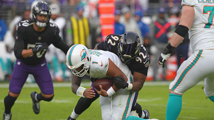 Dec 31, 2023; Baltimore, Maryland, USA; Baltimore Ravens tackle Justin Madubuike (92) sacks Miami Dolphins quarterback Tua Tagovailoa (1) during the third quarter at M&T Bank Stadium. Mandatory Credit: Mitch Stringer-Imagn Images