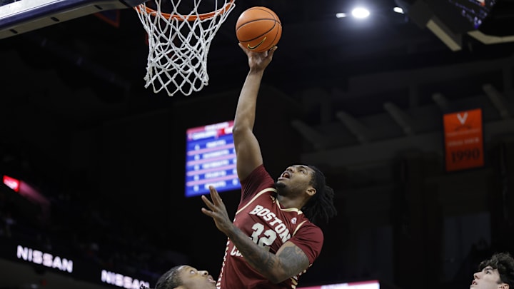 Jan 21, 2025; Charlottesville, Virginia, USA; Boston College Eagles forward Chad Venning (32) shoots the ball over Virginia Cavaliers guard Dai Dai Ames (7) during the first half at John Paul Jones Arena. Mandatory Credit: Amber Searls-Imagn Images