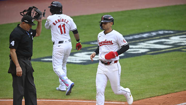 Cleveland Guardians second base Andrés Gimenez (0) scores a run in the fifth inning against the Detroit Tigers  during game five of the ALDS for the 2024 MLB Playoffs at Progressive Field.