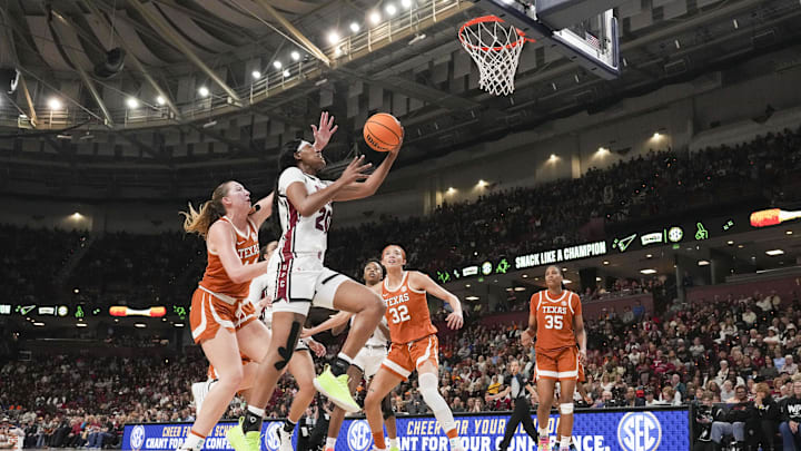 Mar 9, 2025; Greenville, SC, USA; South Carolina Gamecocks forward Sania Feagin (20) goes to the basket past Texas Longhorns forward Taylor Jones (44) during the second half at Bon Secours Wellness Arena. Mandatory Credit: Jim Dedmon-Imagn Images Mar 9, 2025; Greenville, SC, USA; South Carolina Gamecocks forward Sania Feagin (20) goes to the basket past Texas Longhorns forward Taylor Jones (44) during the second half at Bon Secours Wellness Arena. Mandatory Credit: Jim Dedmon-Imagn Images