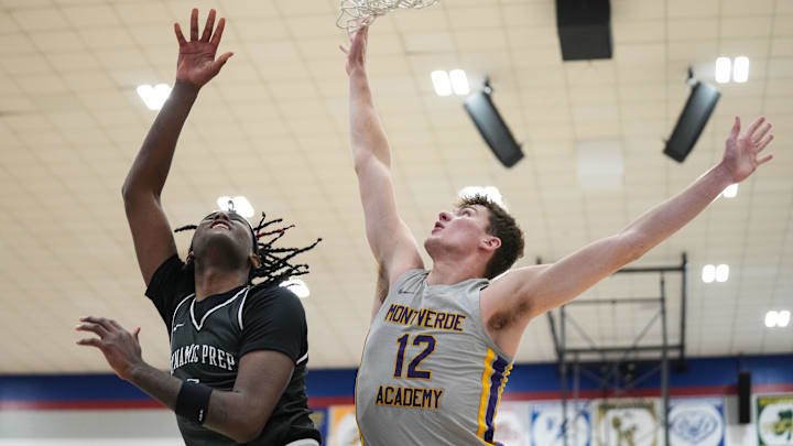 Montverde's Trent Sisley (12) goes in to block a lay-up Wednesday, April 2, 2025, during the first game of the Chipotle Nationals at Hamilton Southeastern High School in Fishers.