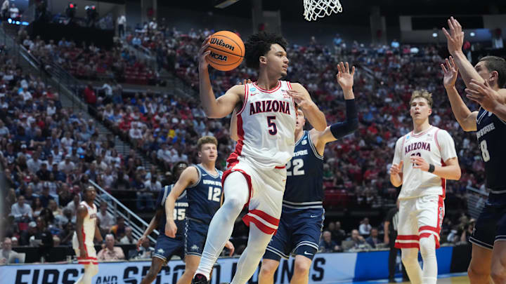 Mar 22, 2026; San Diego, CA, USA; Arizona Wildcats guard Brayden Burries (5) looks to pass against the Utah State Aggies in the first half during a second round game of the men's 2026 NCAA Tournament at Viejas Arena. Mandatory Credit: Kirby Lee-Imagn Images