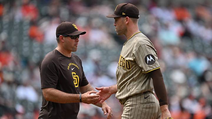 Jun 14, 2026; Baltimore, Maryland, USA; San Diego Padres pitcher Jason Adam (40) hands the ball to manager Craig Stammen (14) after being pulled in the seventh inning against the Baltimore Orioles at Oriole Park at Camden Yards. Mandatory Credit: Jamie Sabau-Imagn Images Jun 14, 2026; Baltimore, Maryland, USA; San Diego Padres pitcher Jason Adam (40) hands the ball to manager Craig Stammen (14) after being pulled in the seventh inning against the Baltimore Orioles at Oriole Park at Camden Yards. Mandatory Credit: Jamie Sabau-Imagn Images