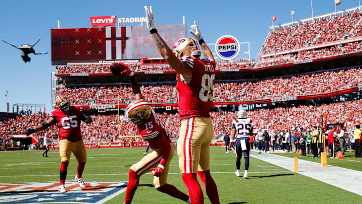 Sep 29, 2024; Santa Clara, California, USA; San Francisco 49ers tight end George Kittle (85) celebrates with wide receiver Jauan Jennings (15) after a touchdown against the New England Patriots during the second quarter at Levi's Stadium. Mandatory Credit: Sergio Estrada-Imagn Images