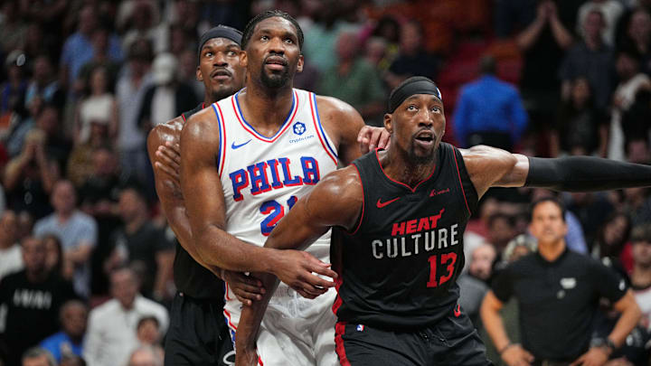 Apr 4, 2024; Miami, Florida, USA;  Miami Heat forward Jimmy Butler (22), Philadelphia 76ers center Joel Embiid (21) and Miami Heat center Bam Adebayo (13) box-out during free throw during the second half at Kaseya Center. Mandatory Credit: Jim Rassol-Imagn Images