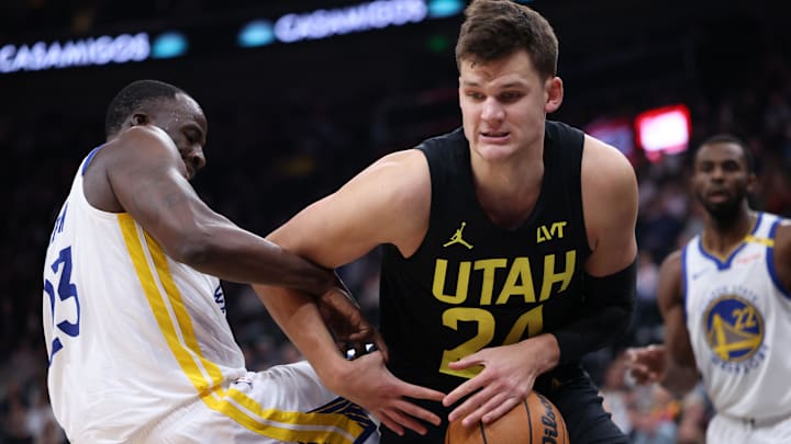 Oct 25, 2024; Salt Lake City, Utah, USA; Utah Jazz center Walker Kessler (24) and Golden State Warriors forward Draymond Green (23) battle for a rebound during the third quarter at Delta Center. Mandatory Credit: Rob Gray-Imagn Images