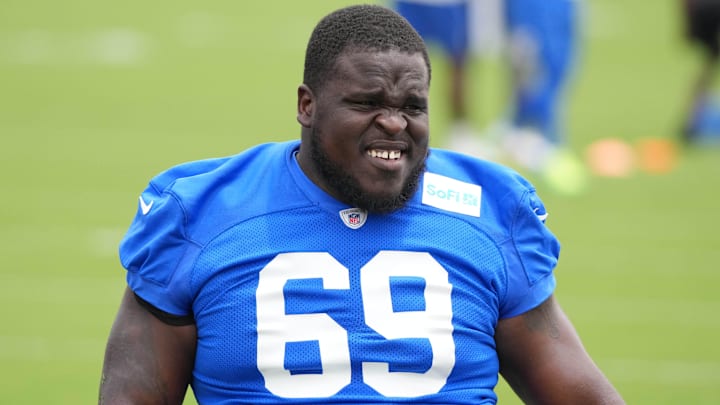 May 28, 2025; Woodland Hills, CA, USA; Los Angeles Rams offensive lineman Kevin Dotson (69) stretches during organized team activities at Rams Practice Facility. Mandatory Credit: Kirby Lee-Imagn Images