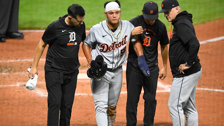Sep 4, 2026; Cleveland, Ohio, USA;  Detroit Tigers designated hitter Hao-Yu Lee (50) is helped to the dugout after he was tagged out sliding into home plate in the third inning against the Cleveland Guardians at Progressive Field.  Mandatory Credit: David Richard-Imagn Images