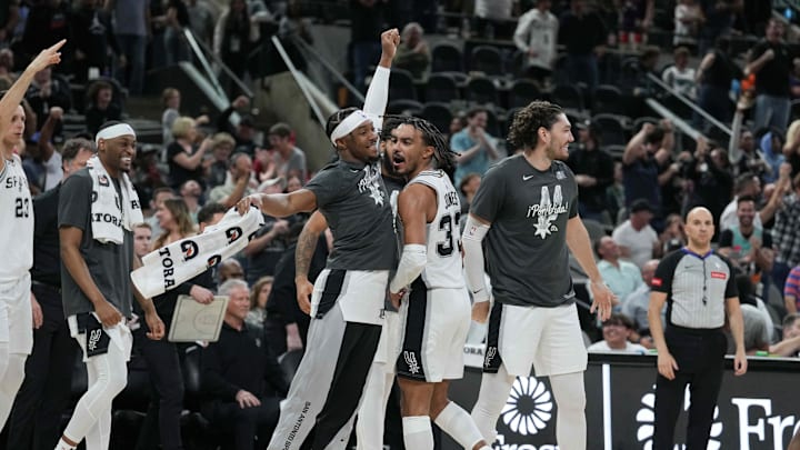 Mar 22, 2024; San Antonio, Texas, USA; San Antonio Spurs guard Blake Wesley (14) celebrates with guard Tre Jones (33) after Jones’ game-tying three-point shot in the second half against the Memphis Grizzlies at Frost Bank Center. Mandatory Credit: Daniel Dunn-Imagn Images