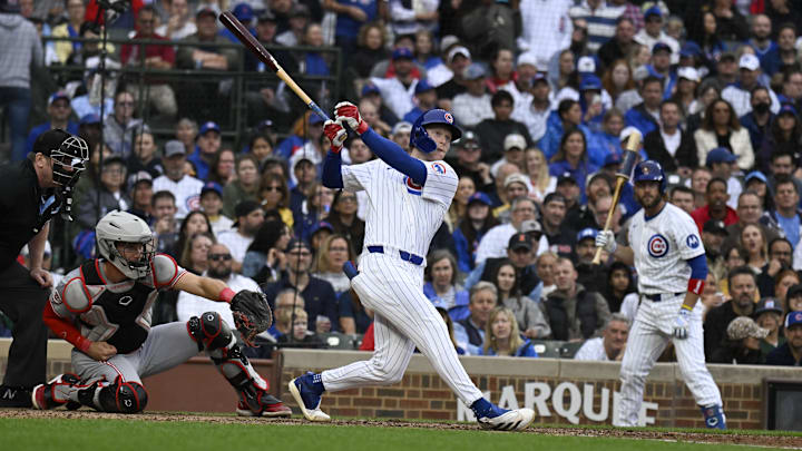 Sep 28, 2024; Chicago, Illinois, USA;  Chicago Cubs outfielder Pete Crow-Armstrong (52) hits an RBI single during the eighth inning against the Cincinnati Reds at Wrigley Field.