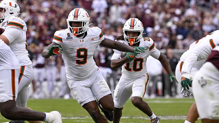 Dec 20, 2025; College Station, TX, USA; Miami Hurricanes wide receiver Malachi Toney (10) runs with the ball behind tight end Elija Lofton (9) during the game between the Aggies and the Hurricanes at Kyle Field. Mandatory Credit: Jerome Miron-Imagn Images