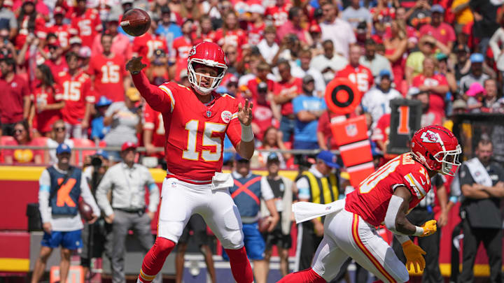 Aug 17, 2024; Kansas City, Missouri, USA; Kansas City Chiefs quarterback Patrick Mahomes (15) throws a pass after faking a handoff to running back Isiah Pacheco (10) against the Detroit Lions during the game at GEHA Field at Arrowhead Stadium. Mandatory Credit: Denny Medley-USA TODAY Sports