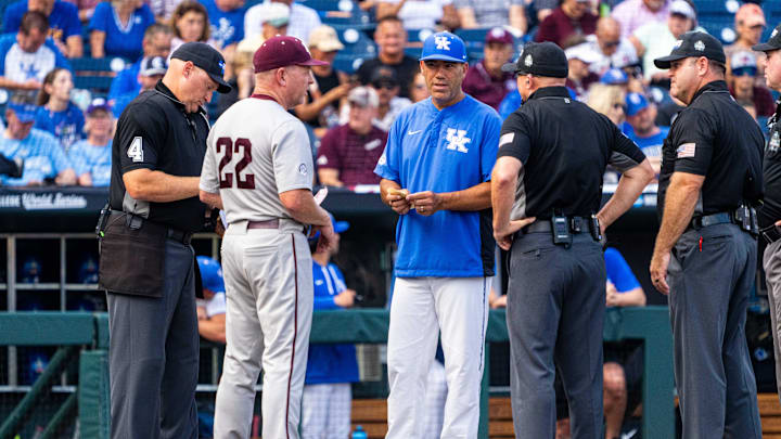 Jun 17, 2024; Omaha, NE, USA; Texas A&M Aggies head coach Jim Schlossnagle (22) and Kentucky Wildcats head coach Nick Mingione meet before the game at Charles Schwab Field Omaha. Mandatory Credit: Dylan Widger-Imagn Images