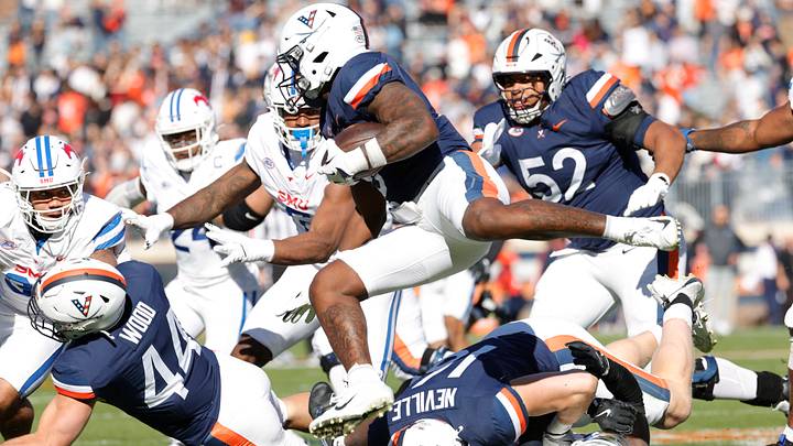 Nov 23, 2024; Charlottesville, Virginia, USA; Virginia Cavaliers running back Kobe Pace (5) carries the ball against the SMU Mustangs during the first half at Scott Stadium. Mandatory Credit: Amber Searls-Imagn Images Nov 23, 2024; Charlottesville, Virginia, USA; Virginia Cavaliers running back Kobe Pace (5) carries the ball against the SMU Mustangs during the first half at Scott Stadium. Mandatory Credit: Amber Searls-Imagn Images