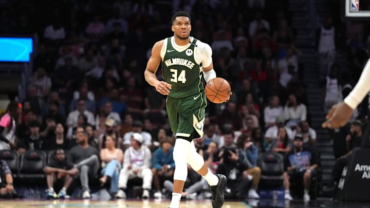 Apr 5, 2025; Miami, Florida, USA;  Milwaukee Bucks forward Giannis Antetokounmpo (34) brings the ball up the court against the Miami Heat during overtime at Kaseya Center. Mandatory Credit: Jim Rassol-Imagn Images