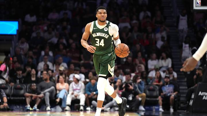 Apr 5, 2025; Miami, Florida, USA;  Milwaukee Bucks forward Giannis Antetokounmpo (34) brings the ball up the court against the Miami Heat during overtime at Kaseya Center. Mandatory Credit: Jim Rassol-Imagn Images