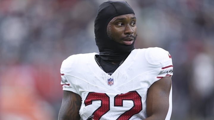 Dec 14, 2025; Houston, Texas, USA; Arizona Cardinals running back Michael Carter (22) walks on the field during practice beore the game against the Houston Texans at NRG Stadium. 