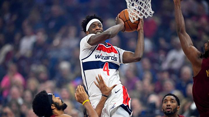 Oct 28, 2026; Cleveland, Ohio, USA; Washington Wizards guard AJ Dybantsa (4) drives to the basket beside Cleveland Cavaliers center Jarrett Allen (31) and guard Donovan Mitchell (45) in the first quarter at Rocket Arena. Mandatory Credit: David Richard-Imagn Images Oct 28, 2026; Cleveland, Ohio, USA; Washington Wizards guard AJ Dybantsa (4) drives to the basket beside Cleveland Cavaliers center Jarrett Allen (31) and guard Donovan Mitchell (45) in the first quarter at Rocket Arena. Mandatory Credit: David Richard-Imagn Images