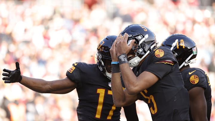 Dec 1, 2024; Landover, Maryland, USA; Washington Commanders quarterback Jayden Daniels (5) celebrates with Washington Commanders wide receiver Terry McLaurin (17) after a touchdown against Tennessee Titans during the first half at Northwest Stadium. Mandatory Credit: Amber Searls-Imagn Images