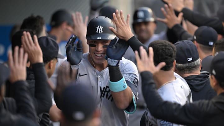 May 30, 2024; Anaheim, California, USA;  New York Yankees center fielder Aaron Judge (99) is congratulated in the dugout after hitting a two-run home run in the fourth inning against the Los Angeles Angels at Angel Stadium. Mandatory Credit: Jayne Kamin-Oncea-USA TODAY Sports