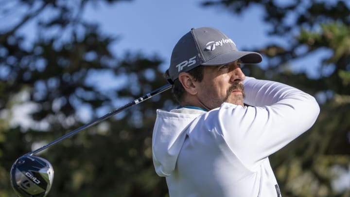 February 2, 2024; Pebble Beach, California, USA; New York Jets quarterback Aaron Rodgers hits his tee shot on the 16th hole during the second round of the AT&T Pebble Beach Pro-Am golf tournament at Pebble Beach Golf Links. February 2, 2024; Pebble Beach, California, USA; New York Jets quarterback Aaron Rodgers hits his tee shot on the 16th hole during the second round of the AT&T Pebble Beach Pro-Am golf tournament at Pebble Beach Golf Links.