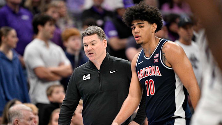 Jan 10, 2026; Fort Worth, Texas, USA; Arizona Wildcats head coach Tommy Lloyd talks with forward Koa Peat (10) during the second half against the TCU Horned Frogs at the Ed and Rae Schollmaier Arena. Mandatory Credit: Jerome Miron-Imagn Images Jan 10, 2026; Fort Worth, Texas, USA; Arizona Wildcats head coach Tommy Lloyd talks with forward Koa Peat (10) during the second half against the TCU Horned Frogs at the Ed and Rae Schollmaier Arena. Mandatory Credit: Jerome Miron-Imagn Images
